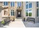 Charming front entrance with covered porch, benches, and potted plants at 11404 Hanbury Manor Blvd, Noblesville, IN 46060