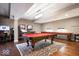 Entertaining game room with pool table, shuffleboard table, and arcade games for Gathering fun at 11404 Hanbury Manor Blvd, Noblesville, IN 46060