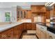 Close up of a kitchen with custom cabinets, stone countertops and stainless appliances at 11404 Hanbury Manor Blvd, Noblesville, IN 46060
