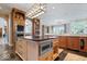 Gourmet kitchen featuring a center island with a microwave and sleek countertops at 11404 Hanbury Manor Blvd, Noblesville, IN 46060