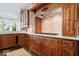 Modern kitchen with stainless steel gas range and custom wood cabinets and drawers at 11404 Hanbury Manor Blvd, Noblesville, IN 46060