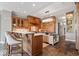 Spacious kitchen featuring custom wood cabinetry, large island, and modern lighting fixtures at 11404 Hanbury Manor Blvd, Noblesville, IN 46060