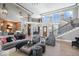 Spacious living room with high ceilings, grand staircase, and elegant decor at 11404 Hanbury Manor Blvd, Noblesville, IN 46060