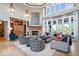 Bright and airy living room with stone fireplace, hardwood floors, and comfortable seating at 11404 Hanbury Manor Blvd, Noblesville, IN 46060