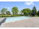 Backyard swimming pool featuring an expansive deck with patio furniture and lush landscaping at 11404 Hanbury Manor Blvd, Noblesville, IN 46060