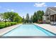 Beautiful swimming pool in a backyard oasis with patio furniture, landscaping, and house view at 11404 Hanbury Manor Blvd, Noblesville, IN 46060
