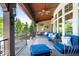 Relaxing porch featuring comfortable seating, wooden ceiling, fan, and wall decor at 11404 Hanbury Manor Blvd, Noblesville, IN 46060