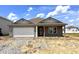Charming single-story home featuring a two-car garage and classic neutral color siding at 1170 Mcbride St, Greenfield, IN 46140