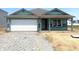 Charming single-story home featuring a two-car garage and a covered front porch at 1170 Mcbride St, Greenfield, IN 46140