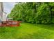 Expansive backyard featuring a well-maintained lawn and a cozy deck, perfect for outdoor entertainment at 11919 Gatwick View Dr, Fishers, IN 46037