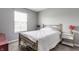 Simple bedroom with neutral walls, a metal bed frame, and minimalistic decor at 11919 Gatwick View Dr, Fishers, IN 46037