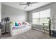 Functional bedroom with a pull-out bed and a ceiling fan, perfect for a  at 11919 Gatwick View Dr, Fishers, IN 46037