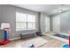 Bonus room with play area featuring wood floors, ample natural light, and neutral paint at 11919 Gatwick View Dr, Fishers, IN 46037