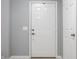Interior entrance to a home featuring neutral paint, tile flooring, and white doors at 11919 Gatwick View Dr, Fishers, IN 46037