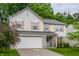 Two-story home featuring a light siding, wooden shutters, and manicured lawn at 11919 Gatwick View Dr, Fishers, IN 46037