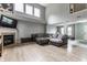 Spacious living room featuring a fireplace, wood floors, and ample natural light at 11919 Gatwick View Dr, Fishers, IN 46037