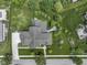 Overhead aerial shot of a luxurious home with lush landscaping, patio and outdoor living spaces at 11984 Talnuck Cir, Fishers, IN 46037