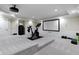 Finished basement featuring a home theater setup and gym equipment at 11984 Talnuck Cir, Fishers, IN 46037
