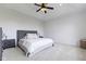 Cozy bedroom with a tray ceiling, ceiling fan, and neutral-toned decor creating a relaxing atmosphere at 11984 Talnuck Cir, Fishers, IN 46037