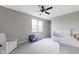 Bright Bedroom featuring comfortable seating, a crib, and a neutral color scheme creates a peaceful retreat at 11984 Talnuck Cir, Fishers, IN 46037