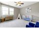 Bright Bedroom with a large window, a crib, and a teepee provides a warm inviting space at 11984 Talnuck Cir, Fishers, IN 46037