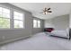 Spacious bedroom featuring a large window, a comfortable bed, and a dark dresser offers a relaxing retreat at 11984 Talnuck Cir, Fishers, IN 46037