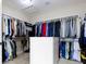 Large walk-in closet with white shelving, storage, and hanging rods provides ample space for storage at 11984 Talnuck Cir, Fishers, IN 46037