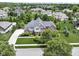 Stunning two-story home with a brick exterior, gray siding, three-car garage, and manicured front yard at 11984 Talnuck Cir, Fishers, IN 46037