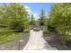 Stone firepit and seating area in a serene backyard setting at 11984 Talnuck Cir, Fishers, IN 46037