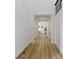 Elegant hallway featuring hardwood floors, decorative molding, and column accents at 11984 Talnuck Cir, Fishers, IN 46037