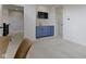 Inviting living room with a blue wet bar and a mounted television, perfect for relaxation and entertainment at 11984 Talnuck Cir, Fishers, IN 46037