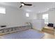 Bright playroom featuring custom shelving, wood floors, and a basketball hoop for recreational activities at 11984 Talnuck Cir, Fishers, IN 46037