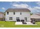 Back view of a two-story home with a patio and outdoor seating area at 1222 Grand Canyon Ct, Franklin, IN 46131