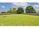 Spacious backyard with a wooden fence and lush green lawn at 1222 Grand Canyon Ct, Franklin, IN 46131