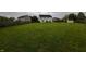 Expansive backyard with lush green grass, a full fence, and ample space for outdoor activities at 1222 Grand Canyon Ct, Franklin, IN 46131