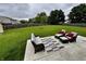 Spacious backyard with furniture on concrete patio and lush green grass at 1222 Grand Canyon Ct, Franklin, IN 46131