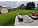 Spacious backyard features a patio with outdoor seating and a well-maintained lawn with full fencing at 1222 Grand Canyon Ct, Franklin, IN 46131