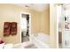 Bathroom with bath tub and glass doored shower featuring a linen closet at 1222 Grand Canyon Ct, Franklin, IN 46131