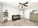 Neutral color bedroom featuring a crib, dresser, ceiling fan, and carpeted floor at 1222 Grand Canyon Ct, Franklin, IN 46131