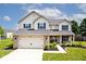 Charming two-story home with blue shutters and attached two-car garage at 1222 Grand Canyon Ct, Franklin, IN 46131