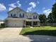 Charming two-story home with a well-manicured lawn and a two car garage at 1222 Grand Canyon Ct, Franklin, IN 46131