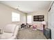 Bright playroom features a comfortable chair, and plenty of natural light at 1222 Grand Canyon Ct, Franklin, IN 46131