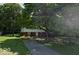 Beautiful two-story home with brick accents, mature trees, and a long driveway on a lush green lawn at 1238 N 650 W, Anderson, IN 46011