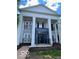 Welcoming building entrance with beautiful architectural details and manicured landscaping at 12853 Tradd St # 2B, Carmel, IN 46032