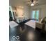 Spacious living room boasts dark wood floors, an open layout, and natural light at 12853 Tradd St # 2B, Carmel, IN 46032