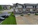 Contemporary townhome featuring private garages, balconies, and well-maintained landscaping at 12908 Grand Blvd, Carmel, IN 46032