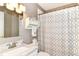 Bathroom with a marble sink, grey walls, and patterned shower curtain at 1308 N Main St, Lapel, IN 46051