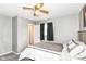 Bright bedroom with a bed, ceiling fan, and an open doorway, perfect for relaxation at 1308 N Main St, Lapel, IN 46051