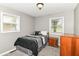 Bedroom featuring carpet, neutral paint, and two windows for natural light at 1308 N Main St, Lapel, IN 46051