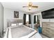 Comfortable bedroom featuring a bed, nightstand, closet with mirrored doors, and a TV at 1308 N Main St, Lapel, IN 46051